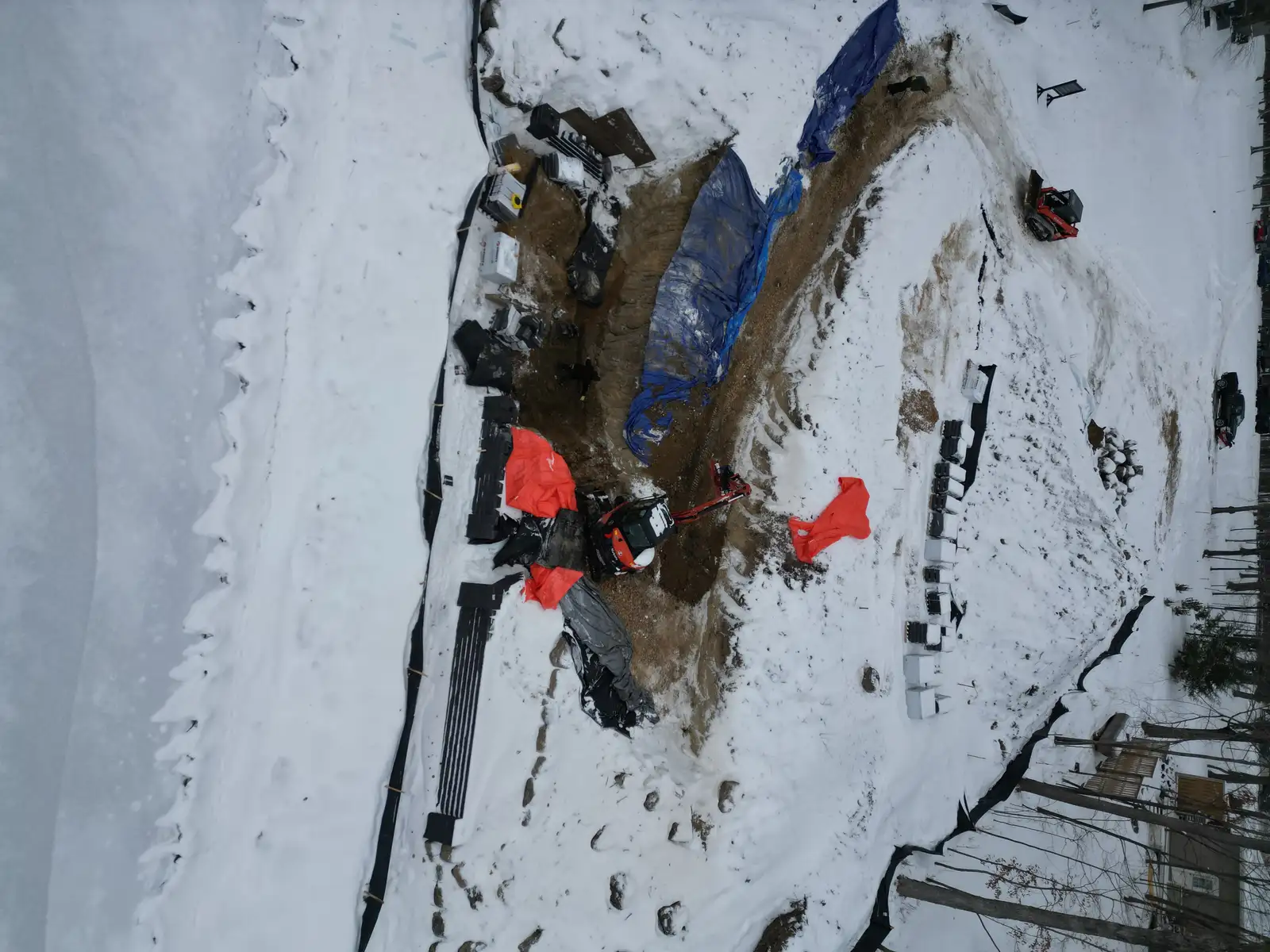 Retaining wall construction in progress in Mound