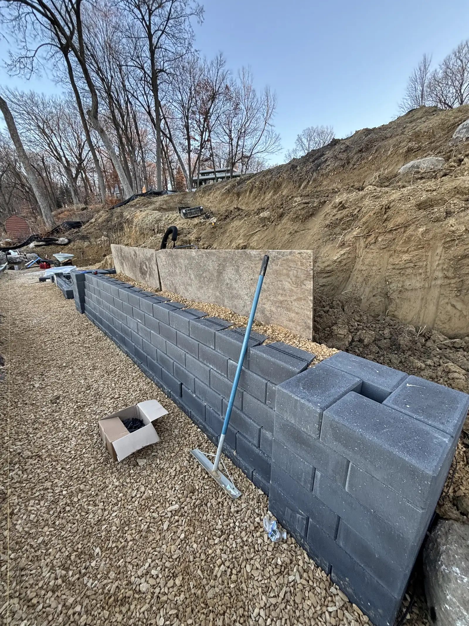 Drainage correction and grading work for erosion prevention on lakeside property