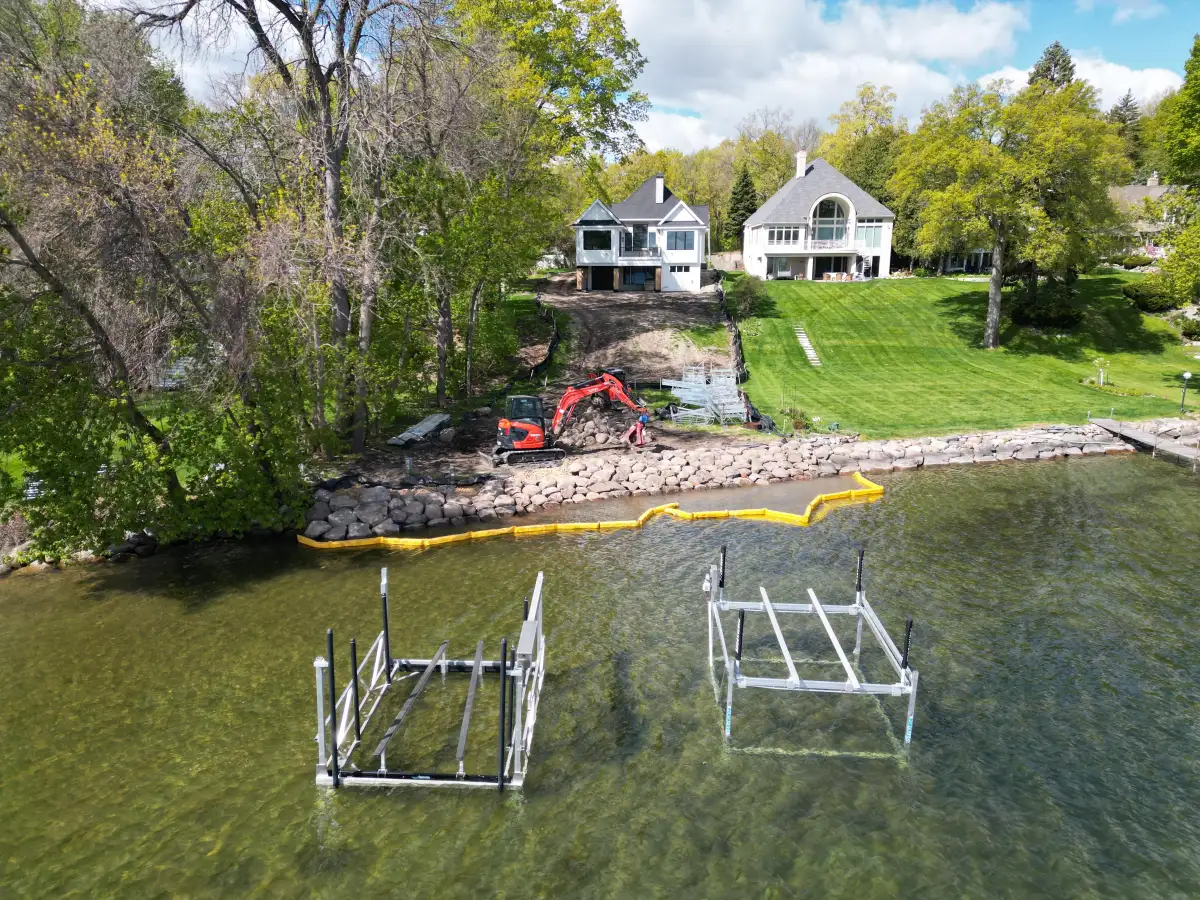 Aerial view of Lake Minnetonka shoreline stabilization project with rip rap boulders in Orono, MN