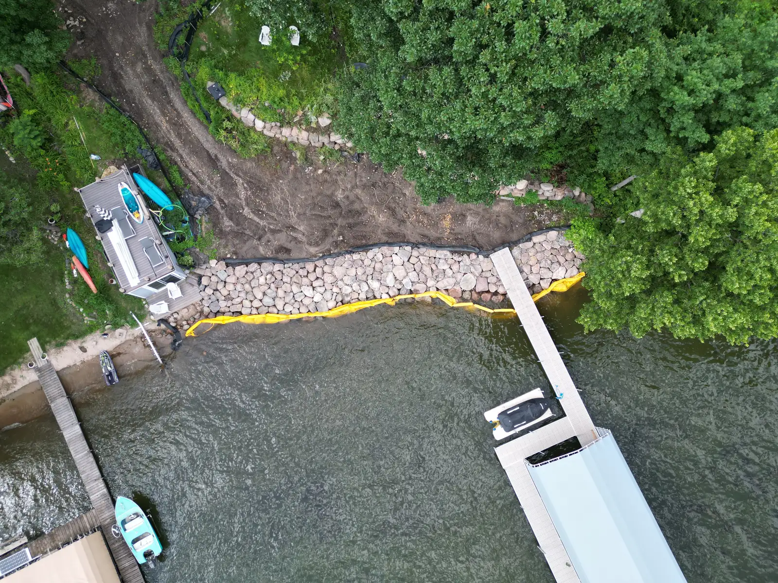 Lake Minnetonka shoreline before riprap rebuild showing erosion damage in Orono, MN