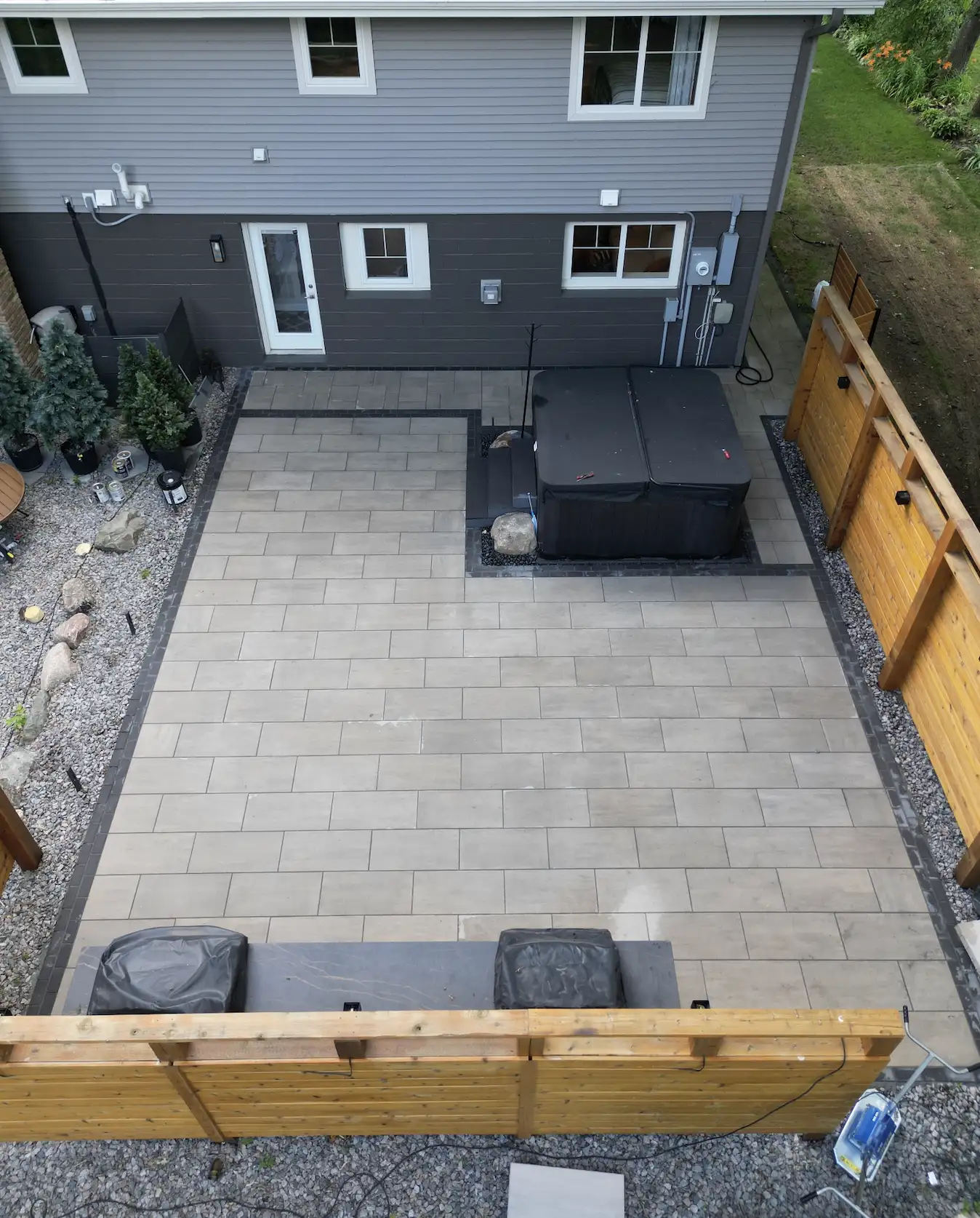 Evening view of outdoor living space with landscape lighting in Waconia, MN