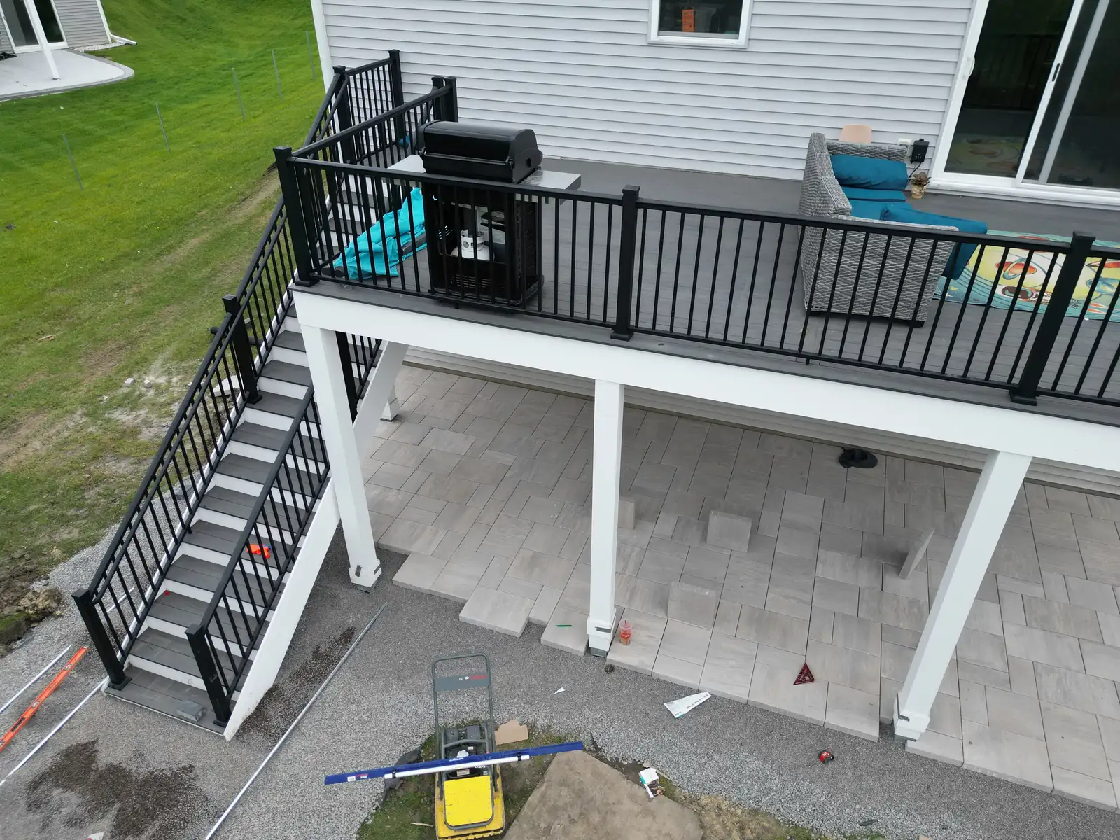 Drainage improvement and grading work alongside paver patio in Wayzata, MN